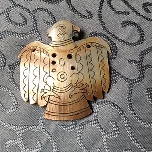 Handmade pin from a shell